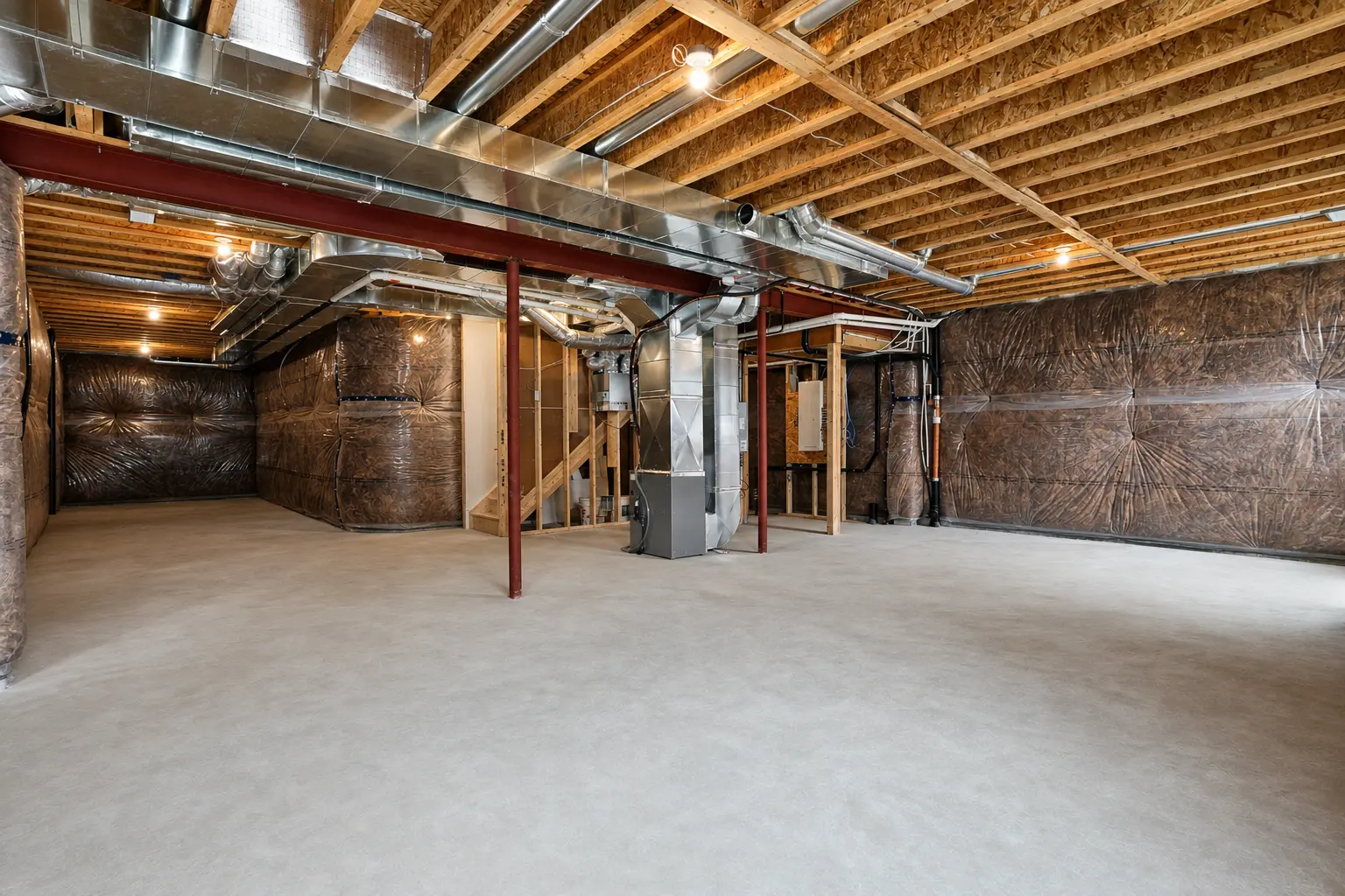 Unfinished basement with high ceilings and mechanical systems